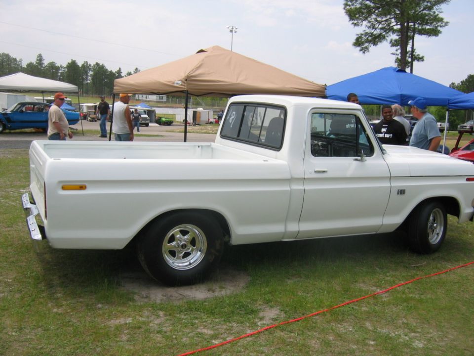 White pickup truck, side view. Appears to be a 1979 Ford F-150