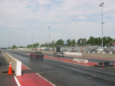 1992 Ford Mustang - A red 1992 Ford Mustang competes in a race at Rockingham Dragway, with another vehicle alongside it.