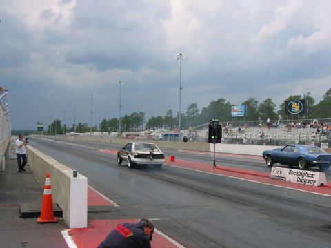 1992 Ford Mustang - A 1992 Ford Mustang competes in a drag race at Rockingham Dragway, captured from a rear-view perspective.