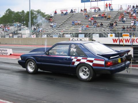 1992 Ford Mustang - A modified Ford Mustang is on the drag strip at Rockingham Dragway, with spectators in the stands.