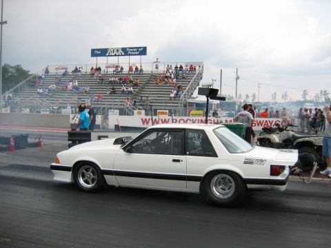 1992 Ford Mustang - A white 1992 Ford Mustang drag car is seen in profile at Rockingham Dragway, ready for a race.