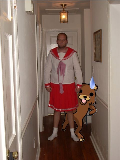 1993 Ford Probe - A person in a sailor-style costume stands in a hallway, accompanied by a cutout of a cartoon bear.