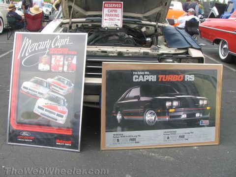 1968 Ford Mustang - Two framed Mercury Capri sales/advertising posters, including a Capri Turbo RS promotion, on display.