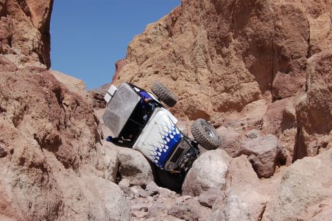 1985 Ford Bronco - This 1985 Ford Bronco is navigating a challenging rocky trail, tilted at an angle.