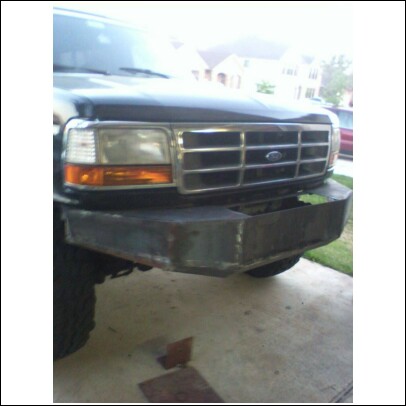 1993 Ford Bronco - A custom metal bumper is fitted to the front of a 1992 Ford Bronco, partially covering the grille.