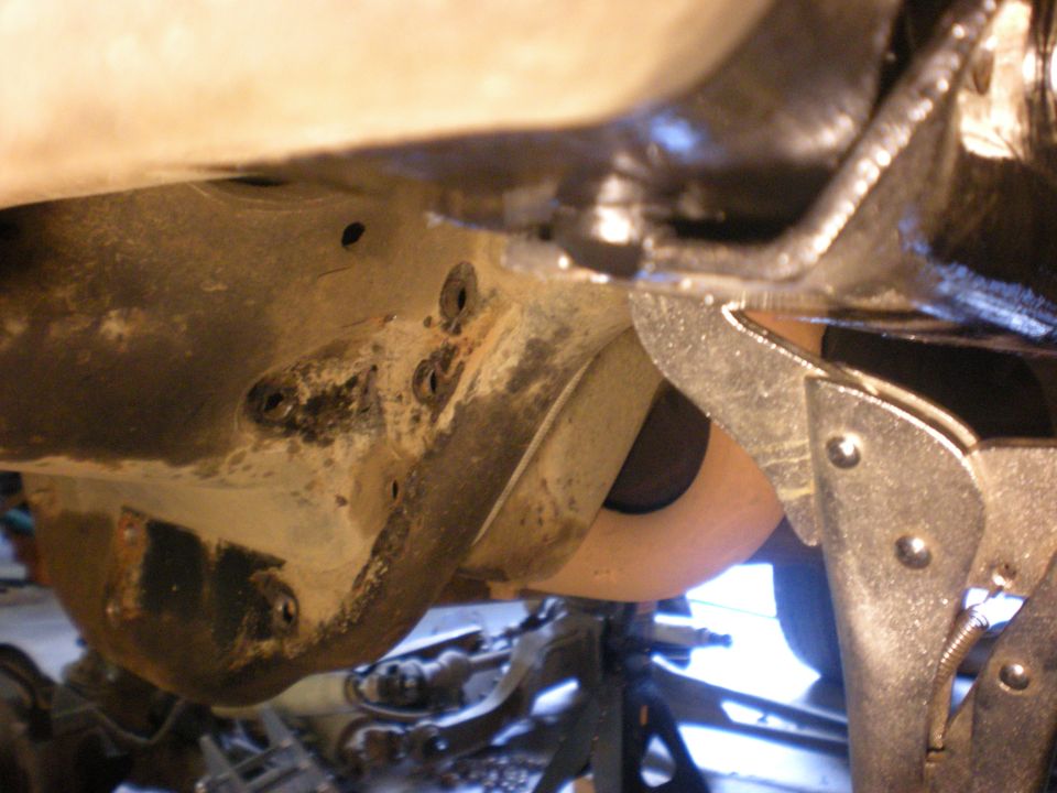 Undercarriage suspension part with clamp and Supermotors logo