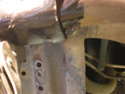 1993 Ford Bronco - Detail shot of vehicle undercarriage components, showing signs of wear and modification.