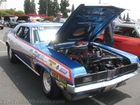 1968 Ford Mustang - This modified 1969 Mercury Cougar features a prominent grille and numerous racing decals.