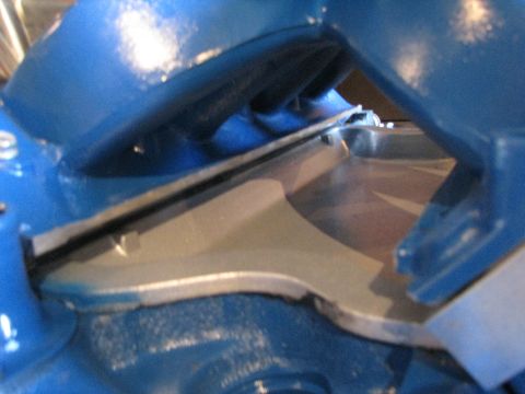 1980 Ford F-250 - Detail of a blue painted engine intake manifold, showing the silver metal internal runners.