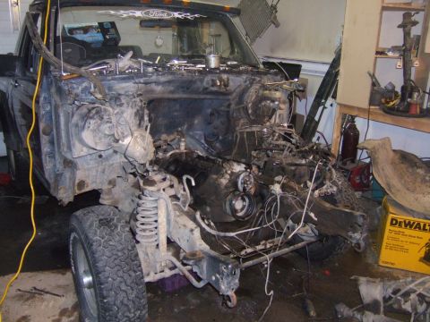 1989 Ford Bronco - This Ford truck is in a state of disassembly, with its engine removed and front end exposed.