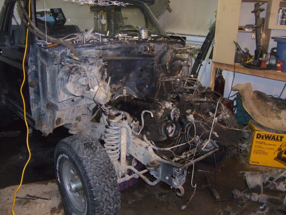 Front view of a disassembled 1989 Ford Bronco with engine removed