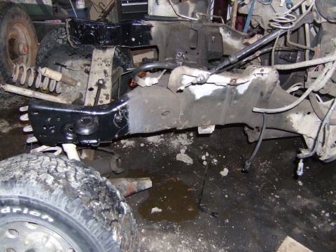 1989 Ford Bronco - Vehicle frame and suspension components are visible in this workshop photo.