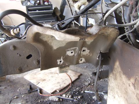 1989 Ford Bronco - Close-up view of a vehicle's frame and engine bay, showing mechanical components and modifications.