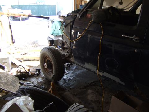 1989 Ford Bronco - This 1989 Ford Bronco is in a garage, appearing to have its engine removed for work.