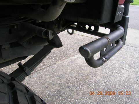1996 Ford Bronco - Close-up view of a vehicle's rear bumper and suspension components.