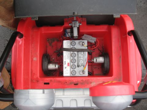 1990 Ford F-250 - Internal components of a device, including a GEL battery and motors, with a Supermotors logo.