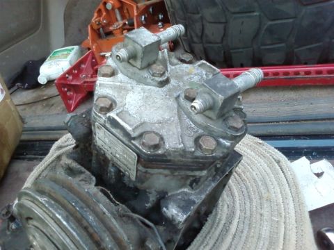 1995 Ford Bronco - This is a York automotive air conditioning compressor, likely removed from a vehicle for repair or replacement.