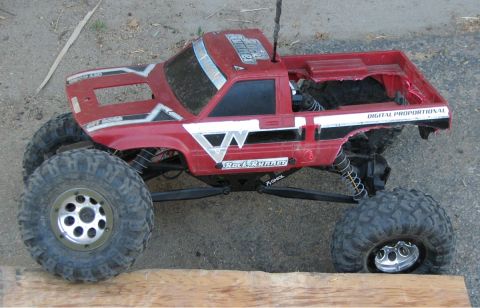 1999 Ford F-150 - This remote control truck features large off-road tires and "Digital Proportional" markings on the bed.