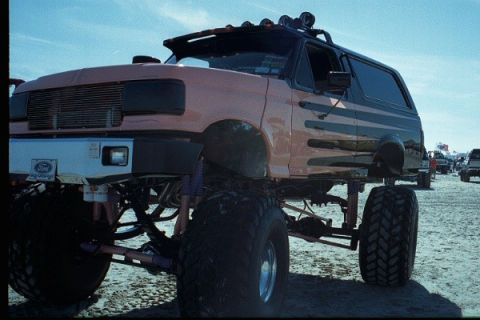 1981 Ford Bronco - This heavily modified Ford Bronco features an extreme lift kit and oversized tires, suggesting it's built for off-road use.
