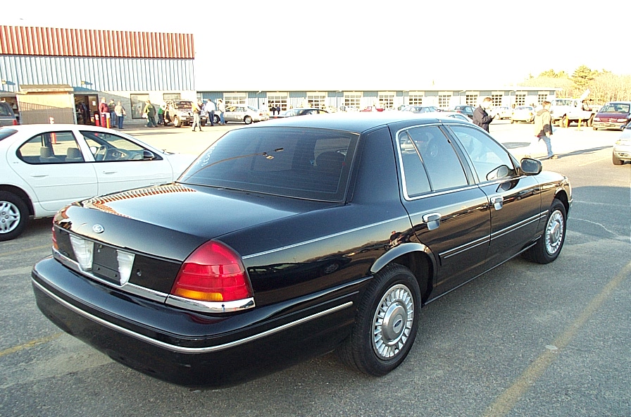 Black 2001 Ford Crown Victoria rear quarter view