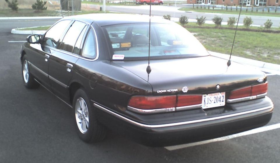 Black 1996 Ford Crown Victoria, rear passenger side view, license plate KJS-2042
