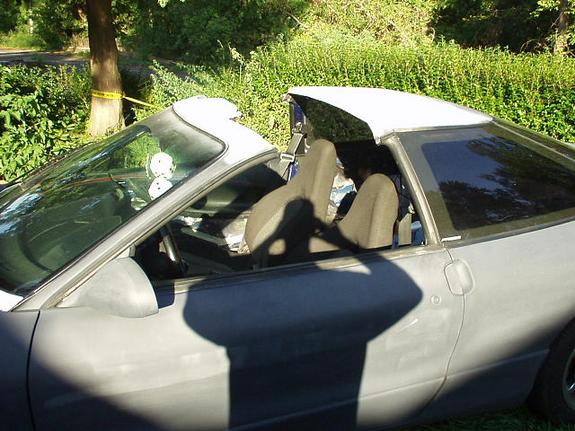 Interior of white car, showing dashboard and seats