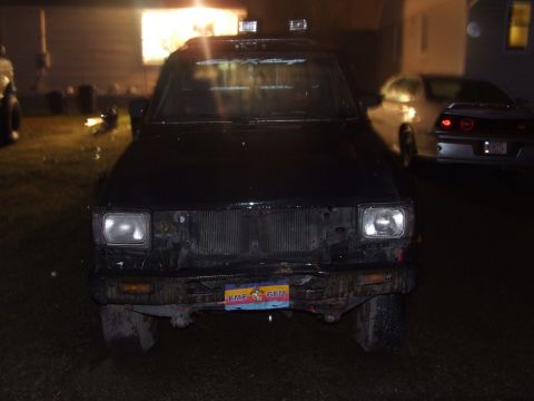1990 Ford Bronco - Front view of a 1990 Ford Bronco captured at night.