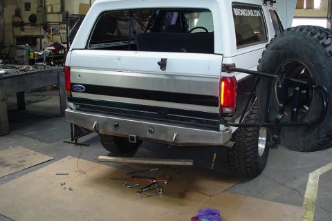 1993 Ford Bronco - The rear of a silver SUV is visible, with a focus on its bumper and taillights.