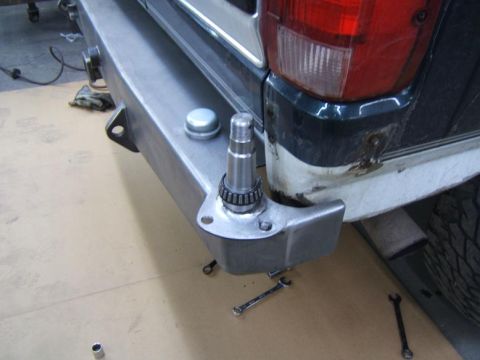 1993 Ford Bronco - Detail of the rear bumper and taillight on a vehicle.