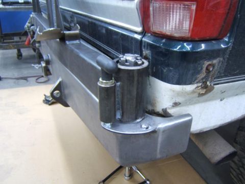 1993 Ford Bronco - Close-up view of a vehicle's rear bumper and tow hitch assembly.