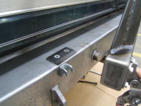 1993 Ford Bronco - This is a close-up view of a vehicle's rear bumper and tow hitch assembly.