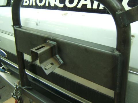 1993 Ford Bronco - A close-up view of a vehicle's rear bumper part, showing the 'BroncoAir' text.
