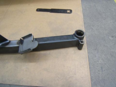 1993 Ford Bronco - Close-up of a metal automotive component, possibly a suspension or frame piece.