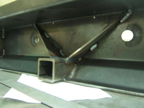 1993 Ford Bronco - Close-up view of a custom fabricated rear bumper part, a square receiver hitch mount and internal bracing.