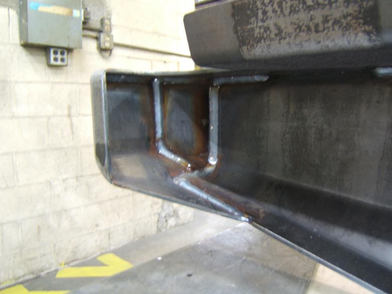 Close-up of welded steel bumper corners and mounting points