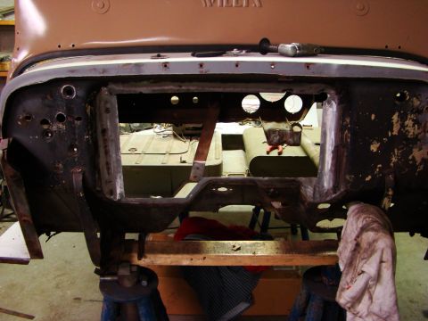 1948 Jeep Wrangler - The frame of a vehicle is shown disassembled, with another vehicle in the background, suggesting a restoration project.