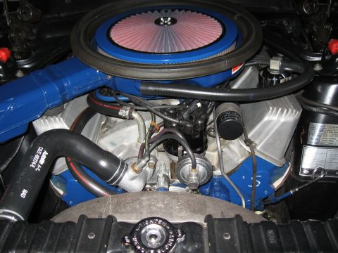 1968 Shelby GT500 - Close-up view of an engine bay, showing various components and hoses.