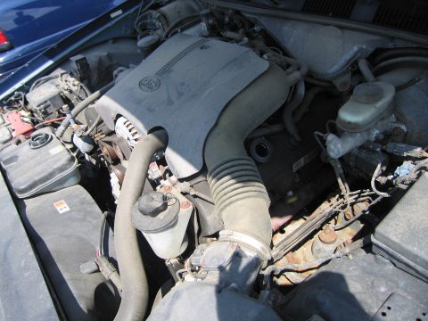 2001 Ford Crown Victoria - Engine bay view of a 2001 Ford Crown Victoria, showing the V8 engine and associated components.