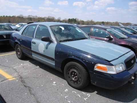 2001 Ford Crown Victoria - This 2001 Ford Crown Victoria is seen in a parking lot with a two-tone paint job and a "20" sticker on the windshield.