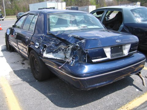 2001 Ford Crown Victoria - This Ford Crown Victoria has sustained heavy damage to its rear quarter panel and bumper.
