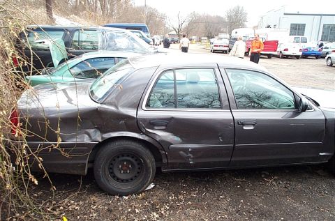 2001 Ford Crown Victoria - This 2001 Ford Crown Victoria sedan has significant damage to its rear quarter panel and rear door.