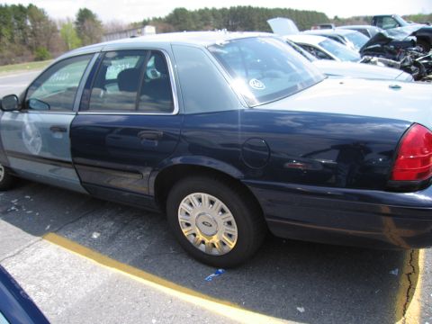 2001 Ford Crown Victoria - This 2001 Ford Crown Victoria police car has a distinctive two-tone paint scheme, with the front half light blue and the rear half dark blu…