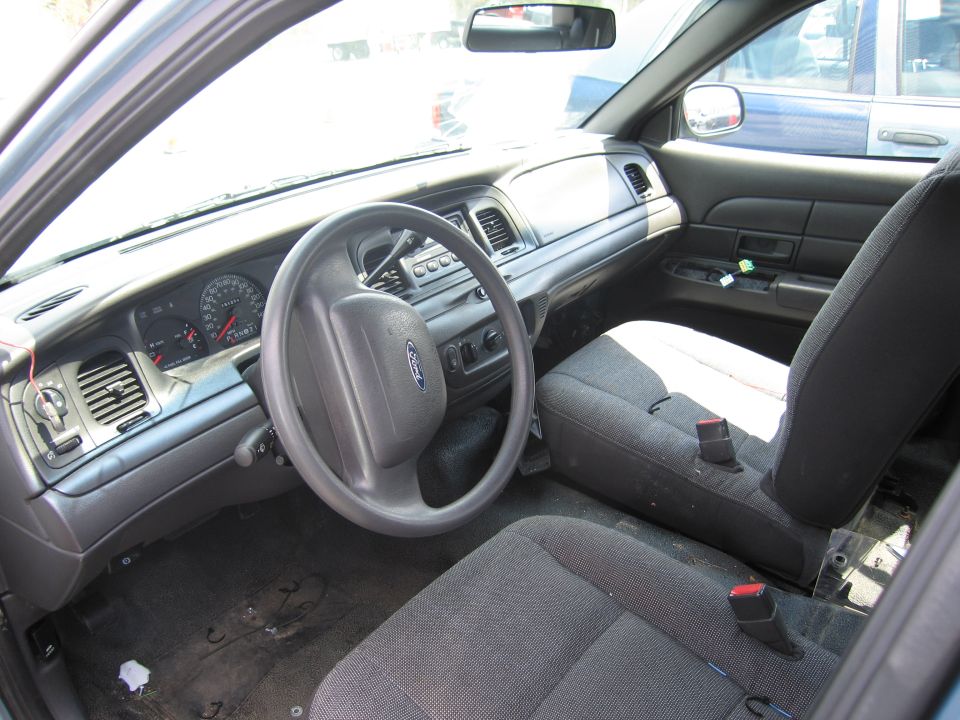 2001 Ford Crown Victoria interior showing dashboard, steering wheel, and seats