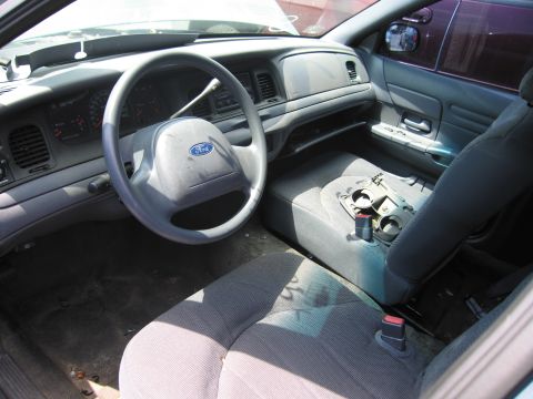 2001 Ford Crown Victoria - Interior view of a 2001 Ford Crown Victoria, highlighting the dashboard and seating areas.