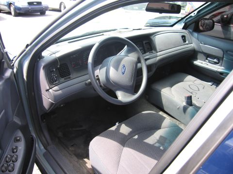 2001 Ford Crown Victoria - Interior of a 2001 Ford Crown Victoria, with another similar vehicle visible through the windshield.