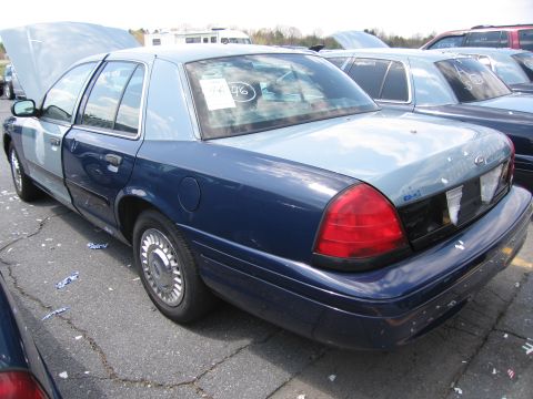2001 Ford Crown Victoria - This Ford Crown Victoria has a two-tone paint job with the hood and roof a lighter shade of blue than the rest of the car.