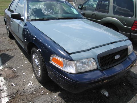 2001 Ford Crown Victoria - This Ford Crown Victoria has a two-tone paint job with a blue body and a light blue hood and fender.