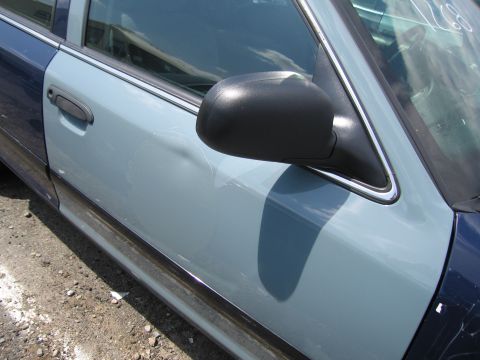 2001 Ford Crown Victoria - Side view of a car door, painted in two different shades of blue, with a black side mirror and chrome trim.