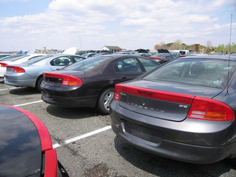 2001 Ford Crown Victoria - Photograph of cars parked in a lot, not a technical document.