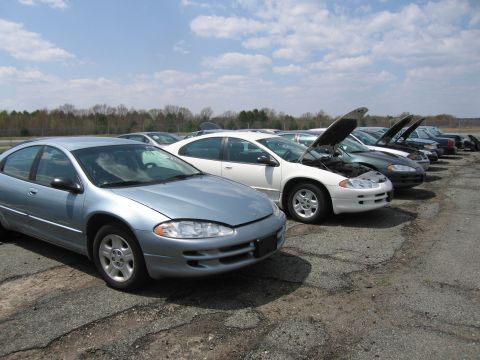 2001 Ford Crown Victoria - Photograph of cars parked in a lot, not a technical document.